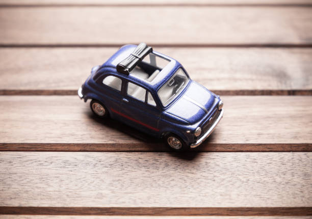 istock Toy car on wooden background 1200017932