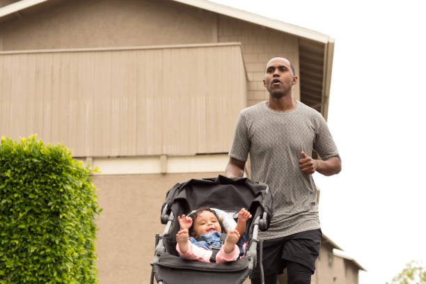 African American father exercising with his daughter.