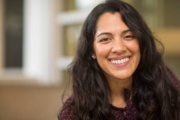 istock Young Hispanic woman smiling. 1200020016