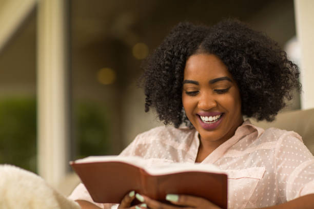 istock Happy woman reading. 1200020177