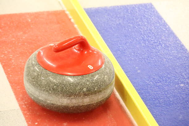 istock Closeup of one red handled curling stone 1200022597