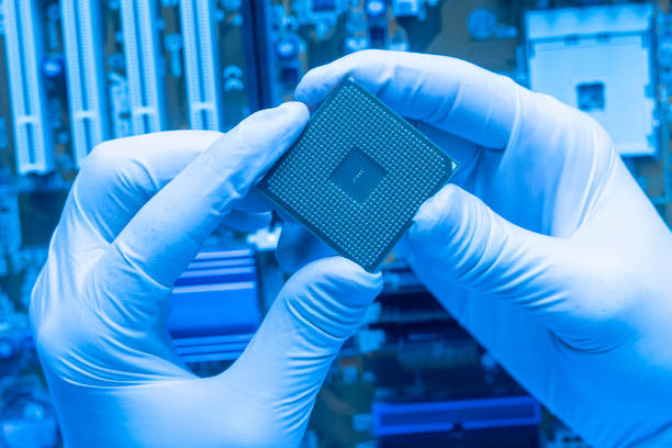 istock close up the scientist hand holding a cpu processor chip, working in the laboratory 1200023284