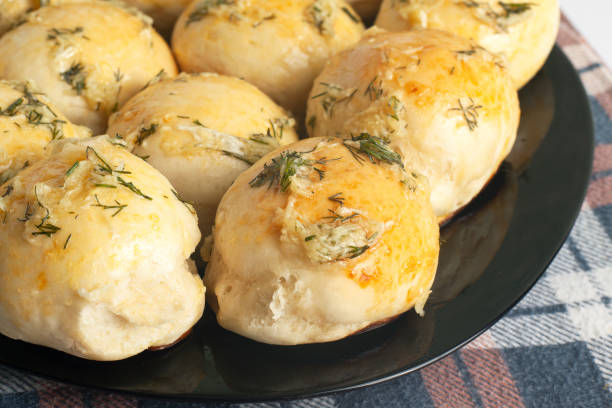 istock buns with dill and garlic closeup.hot baked buns 1200024222