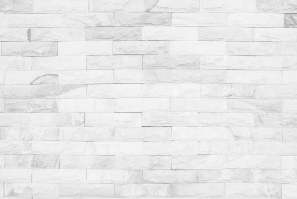 istock Medieval natural stone wall texture background or boundary the rock seamless abstract and decor fragment of design vintage wallpaper pattern chipped ancient from white color for interior copy space. 1200031700