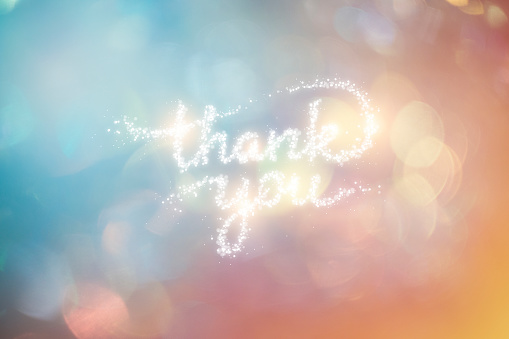 Thank You Phrase Formed by Shiny Confetti with Colorful Background.