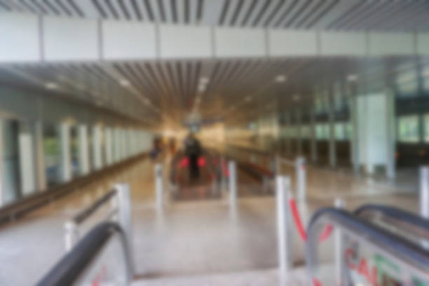 istock People at airport terminal blur background with bokeh light. 1200043319