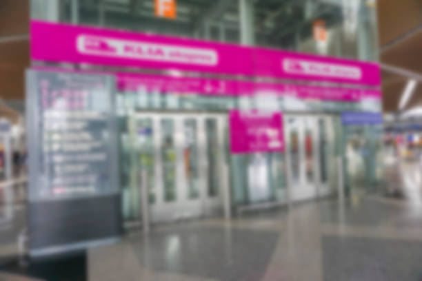 istock People at airport terminal blur background with bokeh light. 1200043344