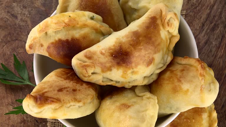 Homemade Empanadas on a rotating plate (seamless loopable)