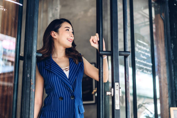 istock Businesswoman working  while standing in front of cafe 1200045327