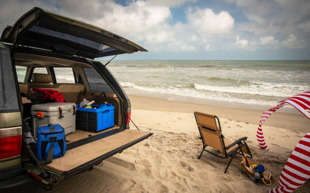 Tailgating on the Beach A tailgating setup just feet from the surf. car trunk stock pictures, royalty-free photos & images