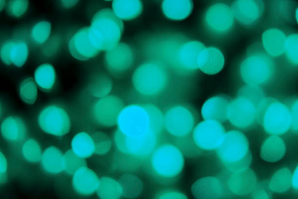 istock Color light blurred bokeh on black background, defocused. Background and pattern decorations 1200047768