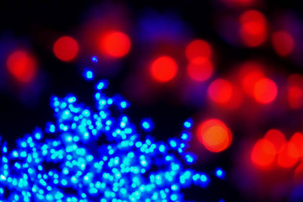 istock Color light blurred bokeh on black background, defocused. Background and pattern decorations 1200047793