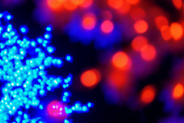 istock Color light blurred bokeh on black background, defocused. Background and pattern decorations 1200047796