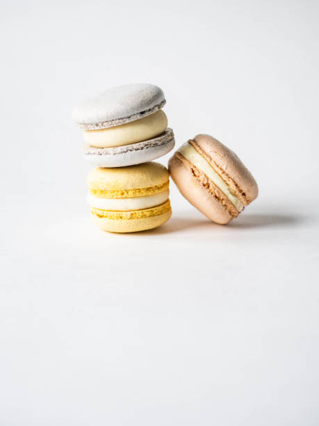 istock Stack of three fresh french pastel colorful macarons on white background. Copy space 1200048866
