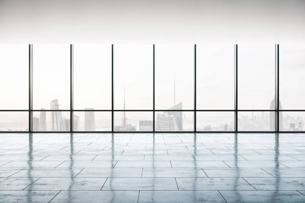 istock Empty office interior with concrete floor, large windows and city view, real estate concept. 3D Rendering 1200049108
