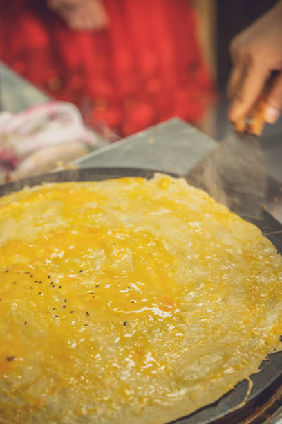 istock Making savoury pancakes in China 1200050063