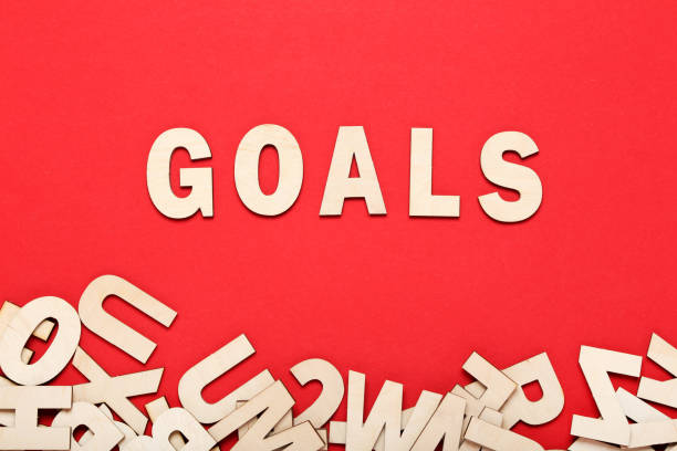 istock Word Goals by wooden letters on red background 1200054912