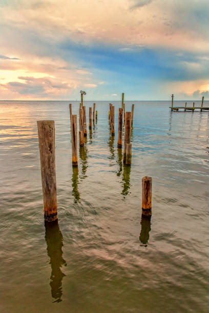 The remnants of a pier along the shores of Lake Pontchartrain, Louisiana, shot at dusk.