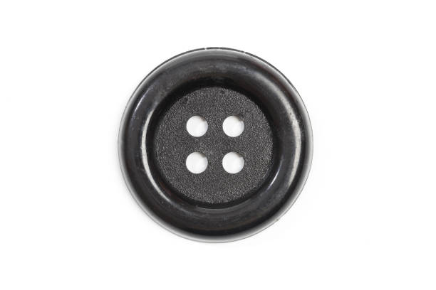 istock Vintage cloth button closeup on white background 1200056103