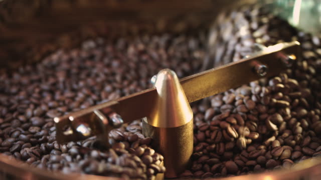 Roasting coffee beans in roaster machine