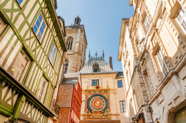 Great Clock of Rouen Famous Gros Horloge (Great Clock) street with astronomical clock tower, main shopping street in Rouen, France rue du gros horloge photos stock pictures, royalty-free photos & images