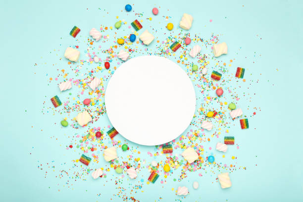 istock Colorful flat lay composition with various party items and candies on blue background 1200059373