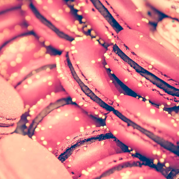 istock Delicious and beautiful pink macaroons on sale. square format, toned 1200059812