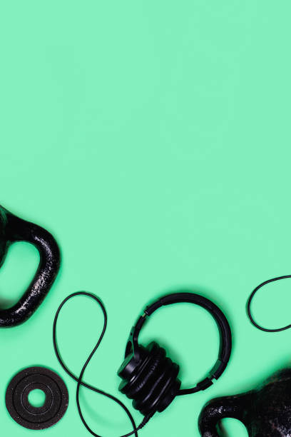istock Kettlebells and dumbbells on color background. 1200061444