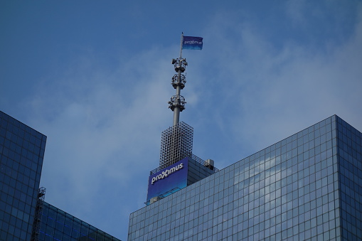 Brussels, Belgium - December 24, 2019: Proximus data center sign on the top of a building. The Proximus Group (previously known as Belgacom Group) is the largest telecommunications company in Belgium