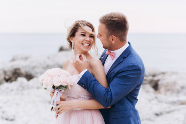 istock Loving couple on the seashore. Wedding. Newlyweds. 1200065549
