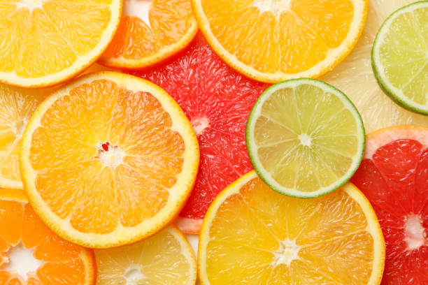 istock Citrus fruits slices texture background, close up 1200066241