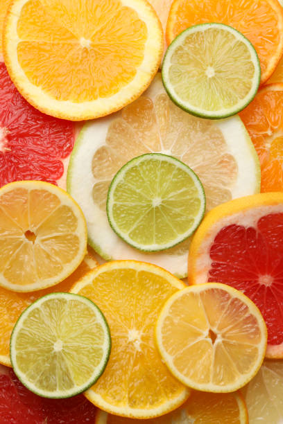 istock Fresh citrus fruits slices texture background, close up 1200066537