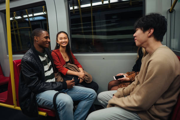 istock Group of multi-ethnic friends traveling by train 1200069991