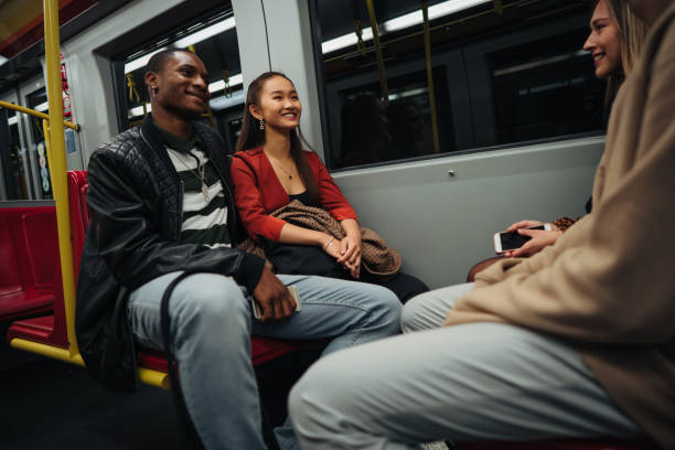 istock Group of multi-ethnic friends traveling by train 1200070094