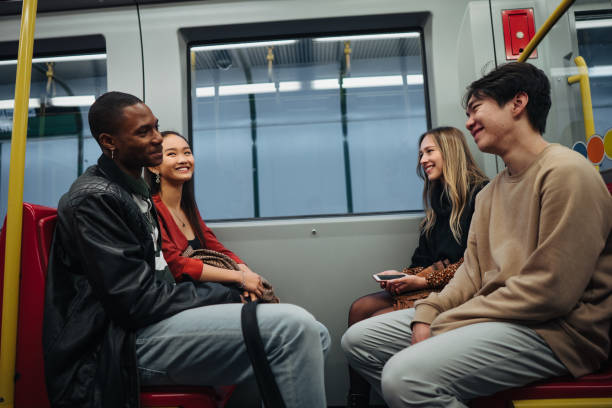 istock Group of multi-ethnic friends traveling by train 1200070140
