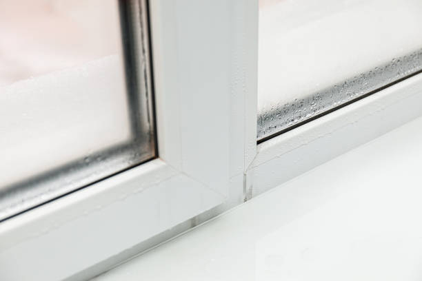 istock Plastic window with damp and water condensation on glass 1200071372