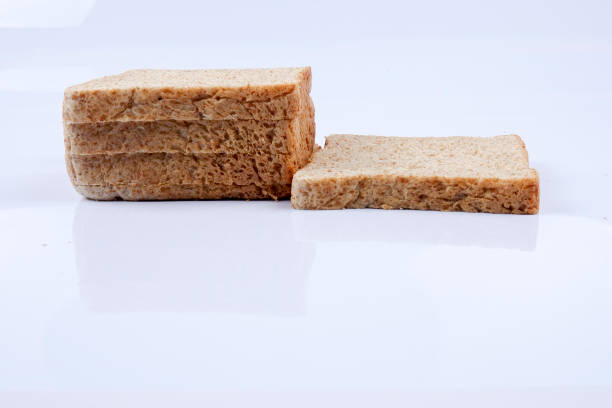 istock Loaf of wholemeal bread on white background 1200071601