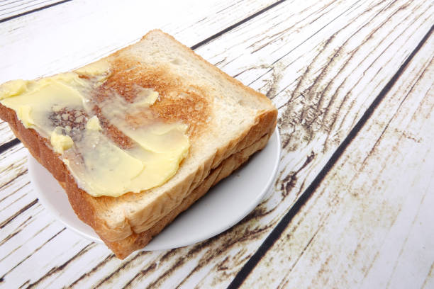istock bread slices over old rustic wooden background, top view, copy space, horizontal composition 1200072240