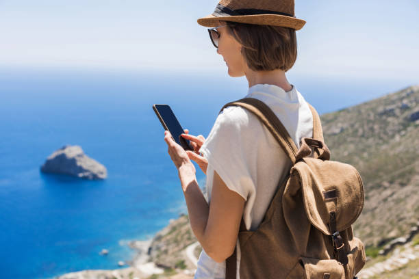 istock Woman using smart phone during travel 1200072299