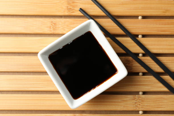 istock Soy sauce on wooden background, space for text. Top view 1200072339