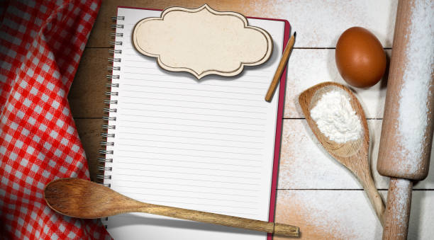 istock Empty copybook for recipes with label, flour, rolling pin and egg 1200074955