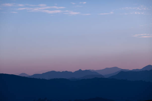 A beautiful sunset over the misty hills in Nepal.