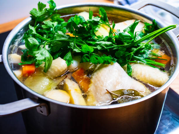 istock Broth - boiling chicken soup in pot 1200081045