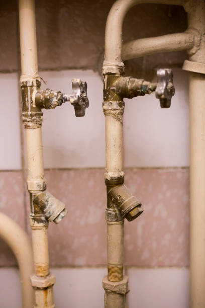 istock Old pipes with faucet valves and broken filters 1200086683