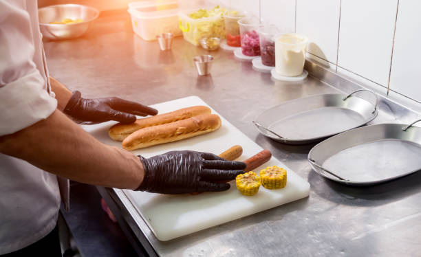 istock The chef cooking hot dog on a grill. Restaurant. 1200090185