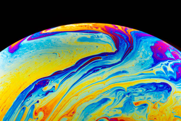 istock Macro shot of a soap bubble hemisphere. Abstract colorful liquid background. 1200090239