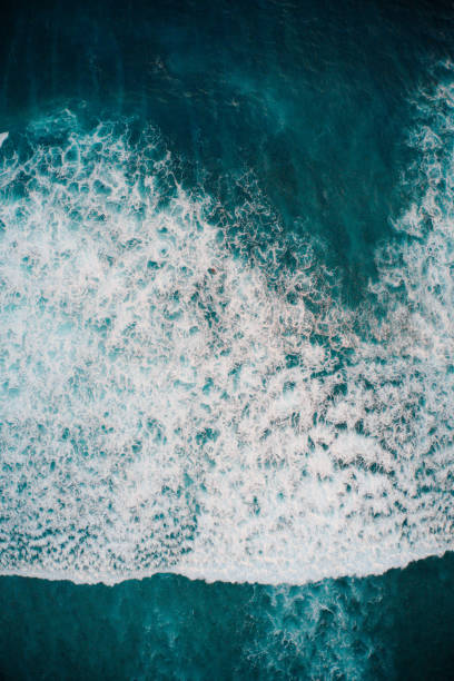 istock Big ocean waves hitting a coral rif. View from above. 1200091564