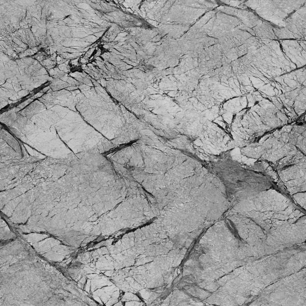 istock The surface of the gray stone is all cracked.Texture or background 1200093486