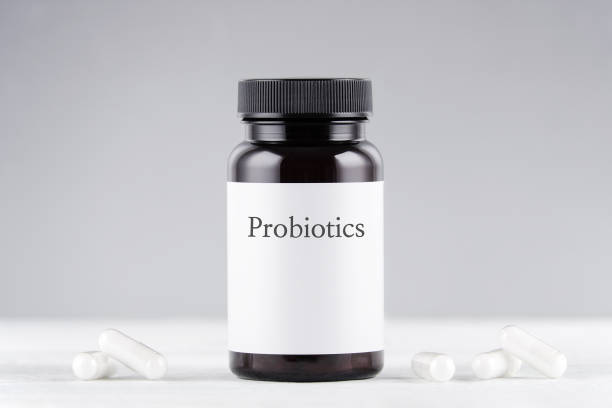 istock nutritional supplement probiotics bottle and capsules on gray 1200095954