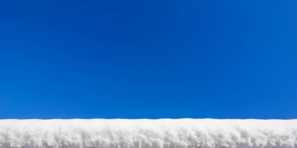 a snowdrift on a background of blue sky